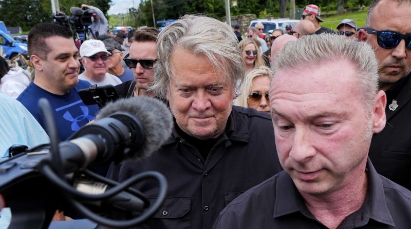 Bannon, a longtime ally of Donald Trump, was taken into custody Monday. Bannon walks to his car before reporting to Danbury Federal Correctional Institution, Monday in Danbury, Conn. 