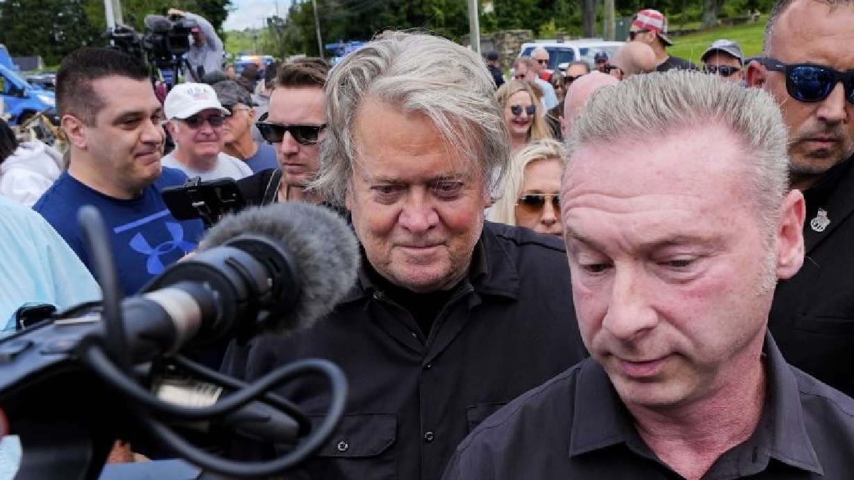 Bannon, a longtime ally of Donald Trump, was taken into custody Monday. Bannon walks to his car before reporting to Danbury Federal Correctional Institution, Monday in Danbury, Conn.