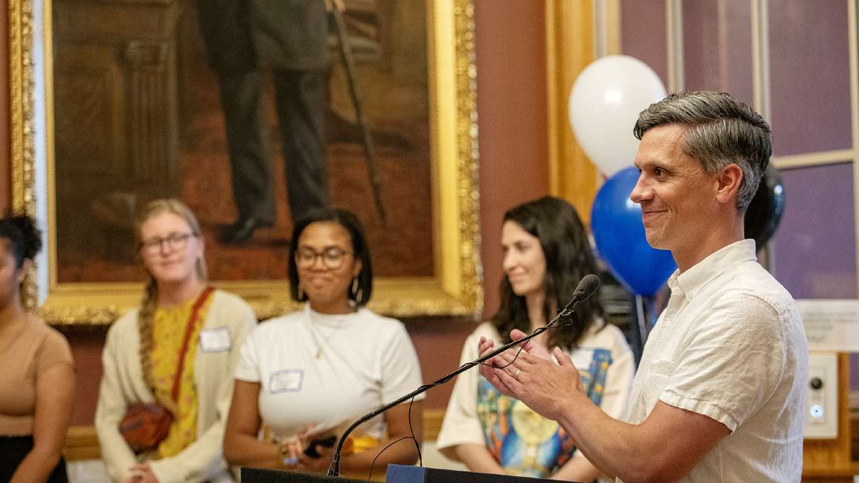 Salt Lake City planner Tom Miller receives an award for accessibility during an event recognization Disability Pride Month which began on July 1.