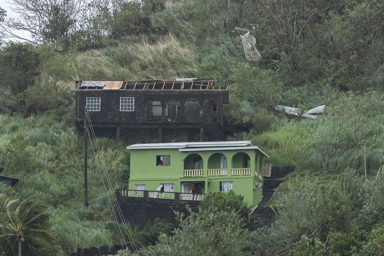 Houses damaged by Hurricane Beryl in Kingstown, St. Vincent and the Grenadines, Monday.