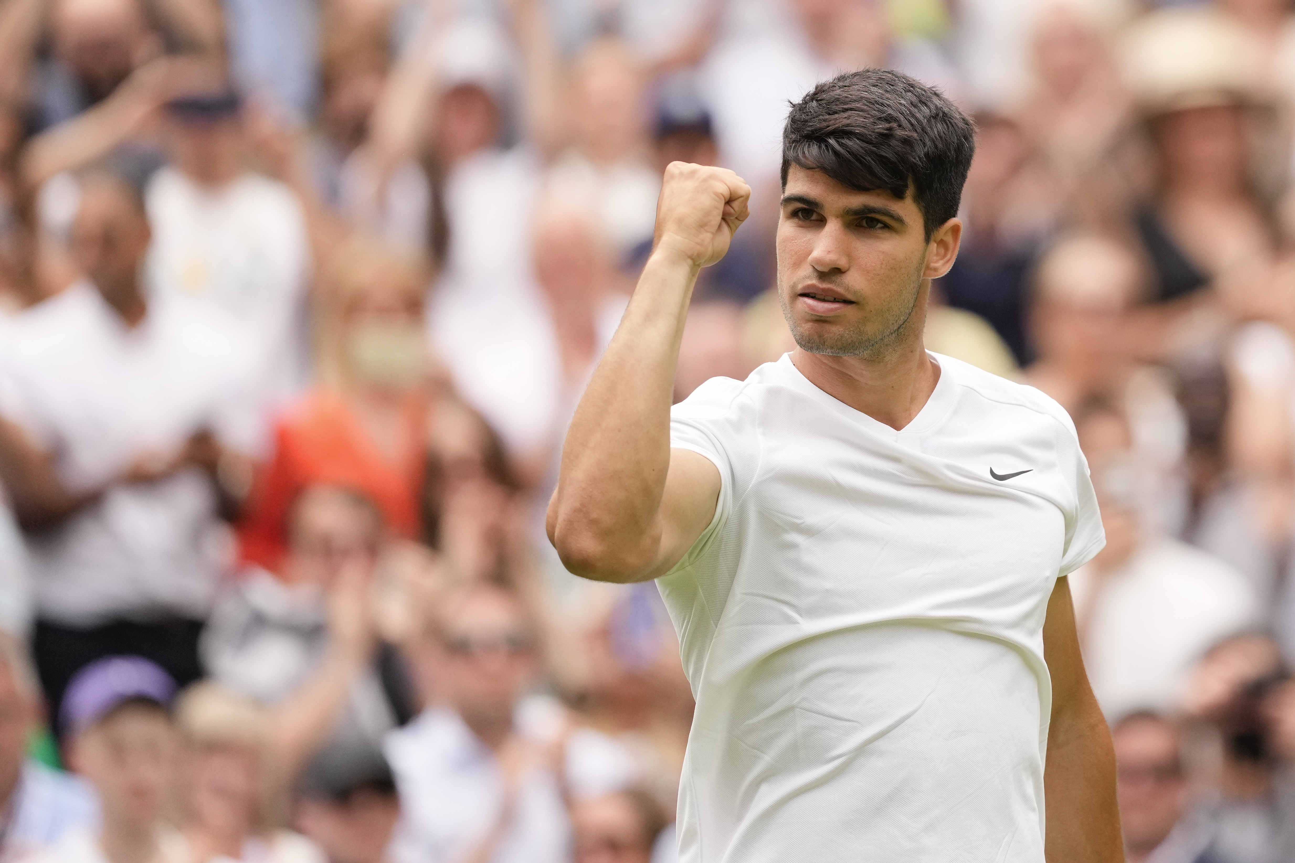 Carlos Alcaraz of Spain reacts after defeating Mark Lajal of Estonia in their first round match of the Wimbledon tennis championships in London, Monday, July 1, 2024.