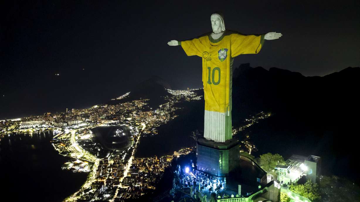 FILE - The Christ the Redeemer statue is illuminated with an image of Pele's Brazilian jersey, as a tribute to the soccer legend on his one-year death anniversary, in Rio de Janeiro, Brazil, Dec. 29, 2023. Brazil's official gazette said July 2, 2024, that President Luiz Inácio Lula da Silva sanctioned a bill to pay tribute to the three-time World Cup winner, naming Nov. 19 as “King Pelé Day”.