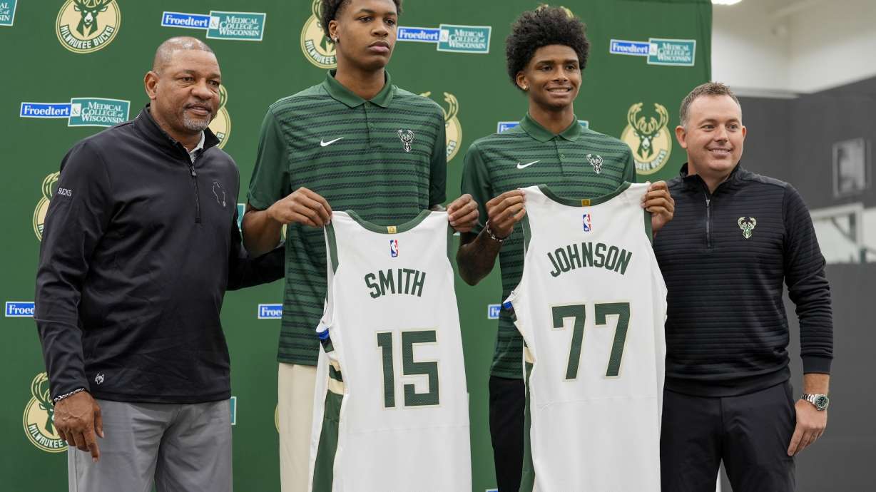 Milwaukee Bucks 2024 draft picks AJ Johnson and Tyler Smith pose for a picture with head coach Doc Rivers and general manager Jon Horst at a news conference Tuesday, July 2, 2024, in Milwaukee.