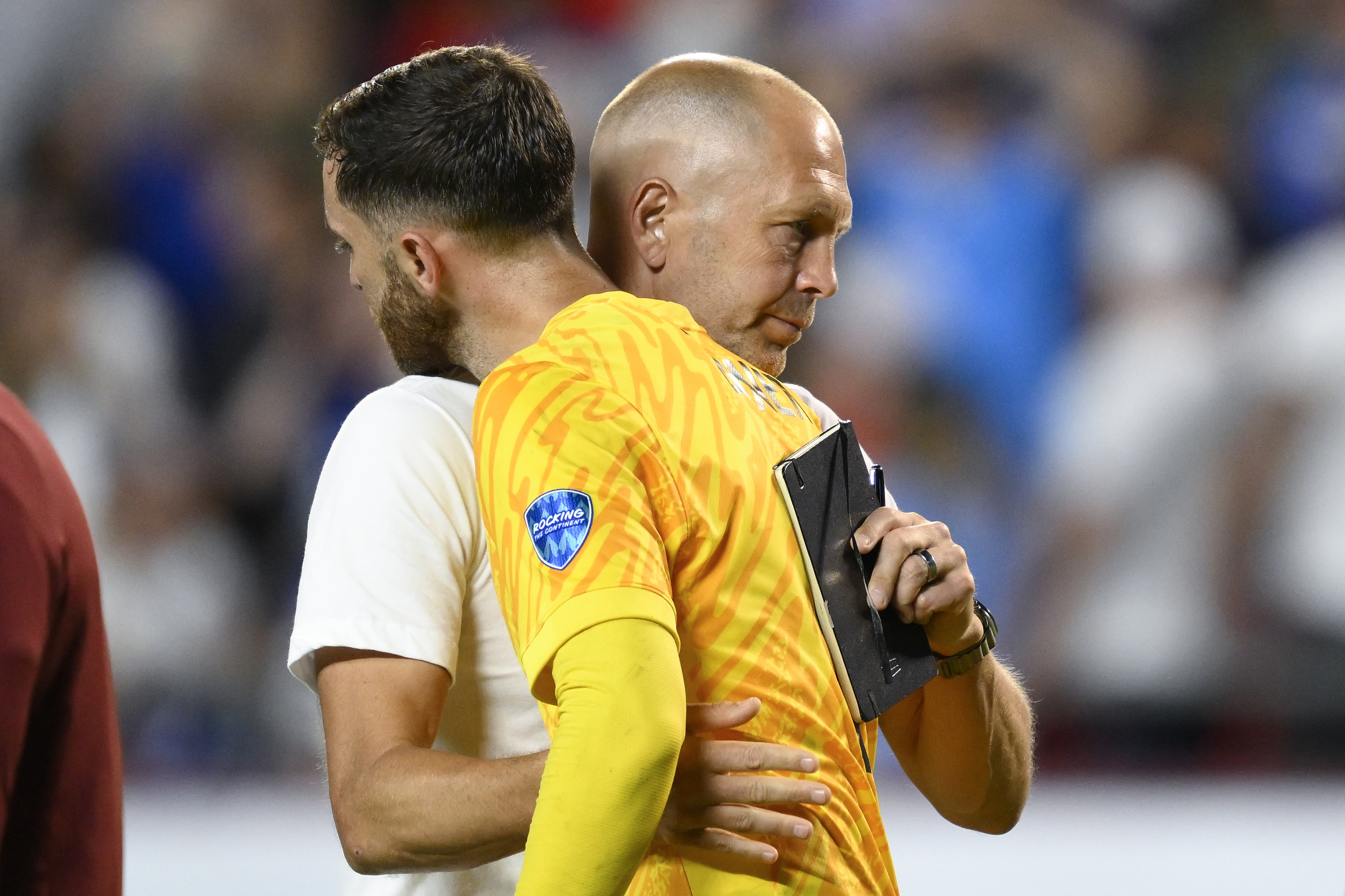 Coach Gregg Berhalter of the United States greets goalkeeper Matt Turner after losing 0-1 against Uruguay at the end of a Copa America Group C soccer match in Kansas City, Mo., Monday, July 1, 2024. 