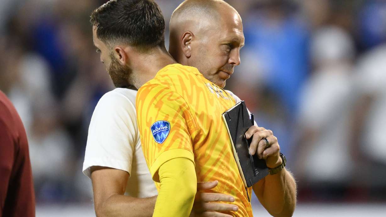 Coach Gregg Berhalter of the United States greets goalkeeper Matt Turner after losing 0-1 against Uruguay at the end of a Copa America Group C soccer match in Kansas City, Mo., Monday, July 1, 2024.