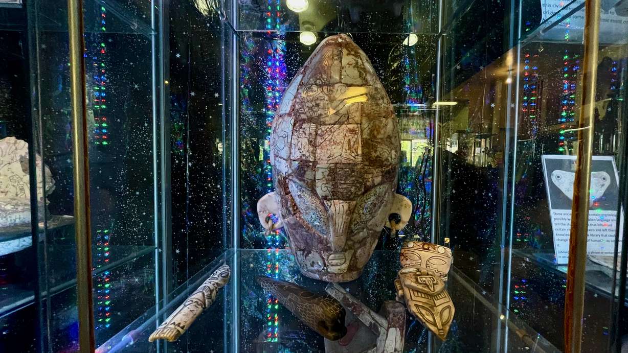A stone figure from Mexico of what Victor Camacho thinks might be an alien head, photographed Tuesday, at his Ogden store called Alien Legacy.