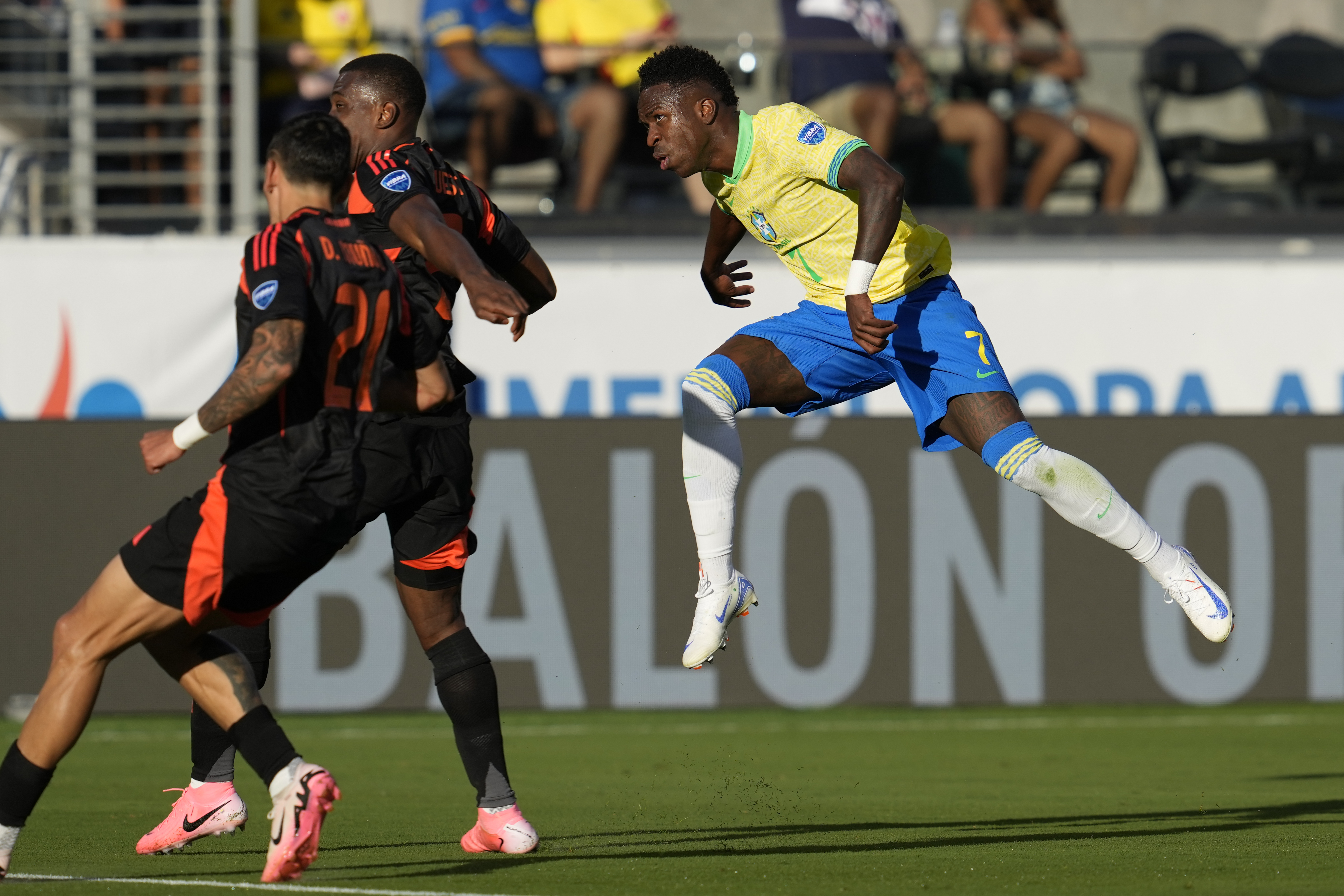 Brazil's Vinicius Junior, center, watches his missed shot on goal during the second half of a Copa America Group D soccer match against Colombia Tuesday, July 2, 2024, in Santa Clara, Calif. 