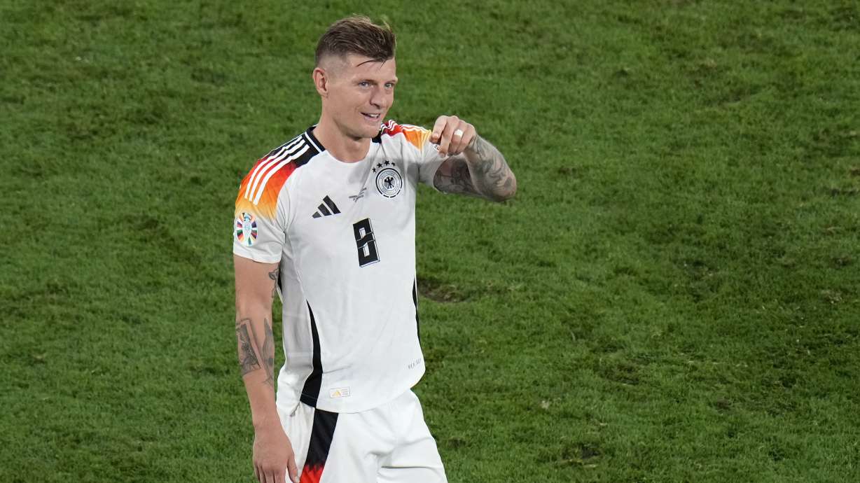 Germany's Toni Kroos applauds fans at the end of the round of sixteen match between Germany and Denmark at the Euro 2024 soccer tournament in Dortmund, Germany, Saturday, June 29, 2024.