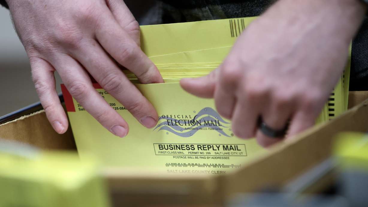 A Salt Lake County employee sorts through primary election ballots in Salt Lake City on June 24. Lt. Gov. Deidre Henderson on Wednesday advised county clerks that election records are not subject to public records requests under Utah law.