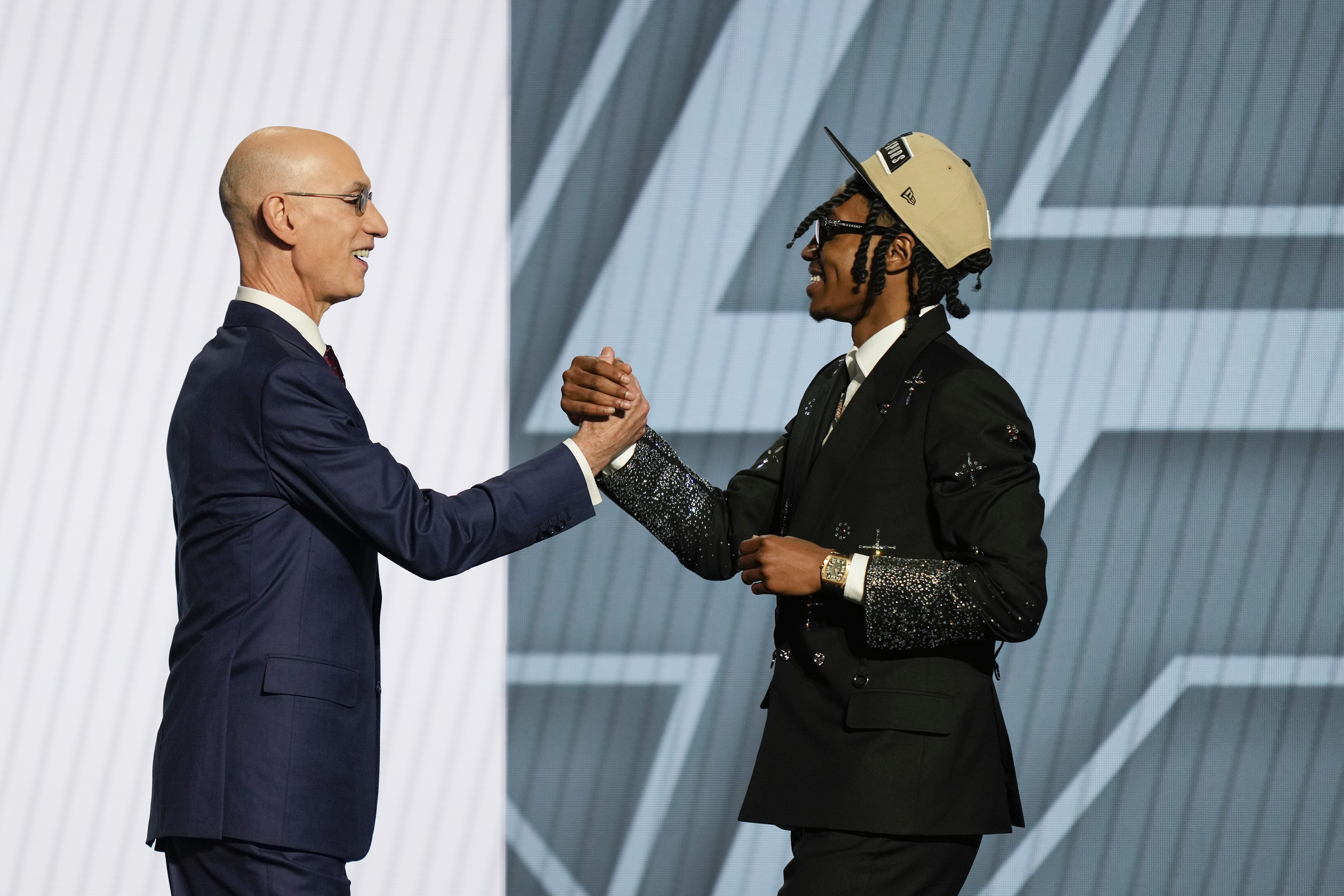 Rob Dillingham, right, greets NBA commissioner Adam Silver after being selected by the San Antonio Spurs during the first round of the NBA basketball draft, Wednesday, June 26, 2024, in New York. 
