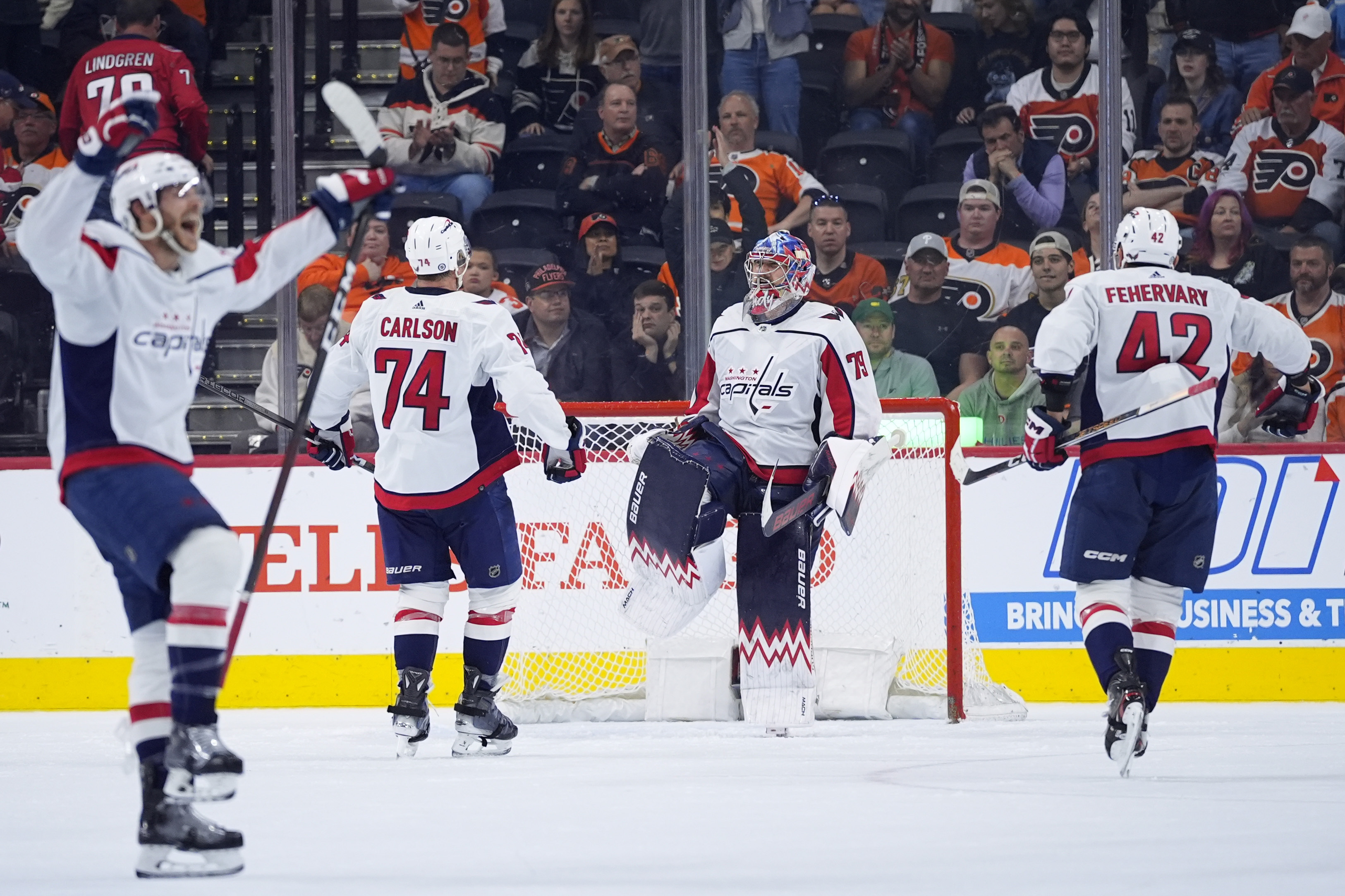 FILE - Washington Capitals' Charlie Lindgren (79) celebrates with Martin Fehervary (42) and John Carlson (74) after the Capitals won an NHL hockey game against the Philadelphia Flyers, Tuesday, April 16, 2024, in Philadelphia. So much for just trying to get Alex Ovechkin to break Wayne Gretzky’s NHL career goals record. The Washington Capitals are going all in to keep their contending window open. 