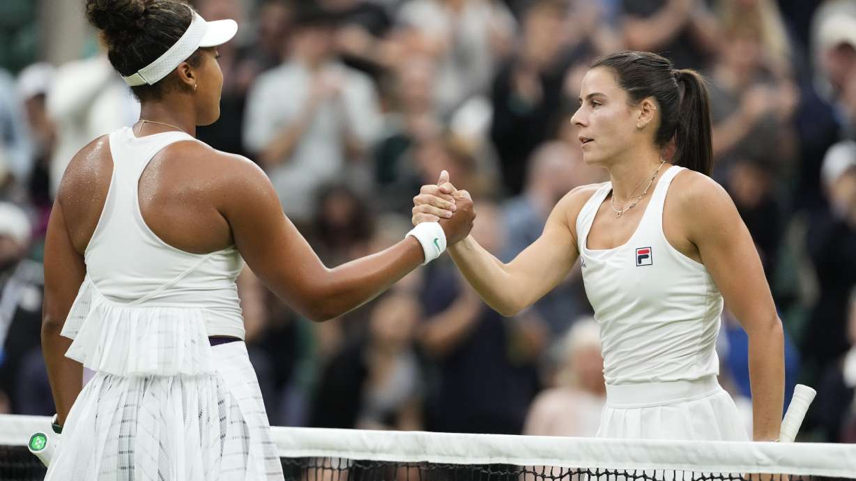 Emma Navarro, right, of the United States is congratulated by Naomi Osaka of Japan following their match on day three at the Wimbledon tennis championships in London, Wednesday, July 3, 2024.