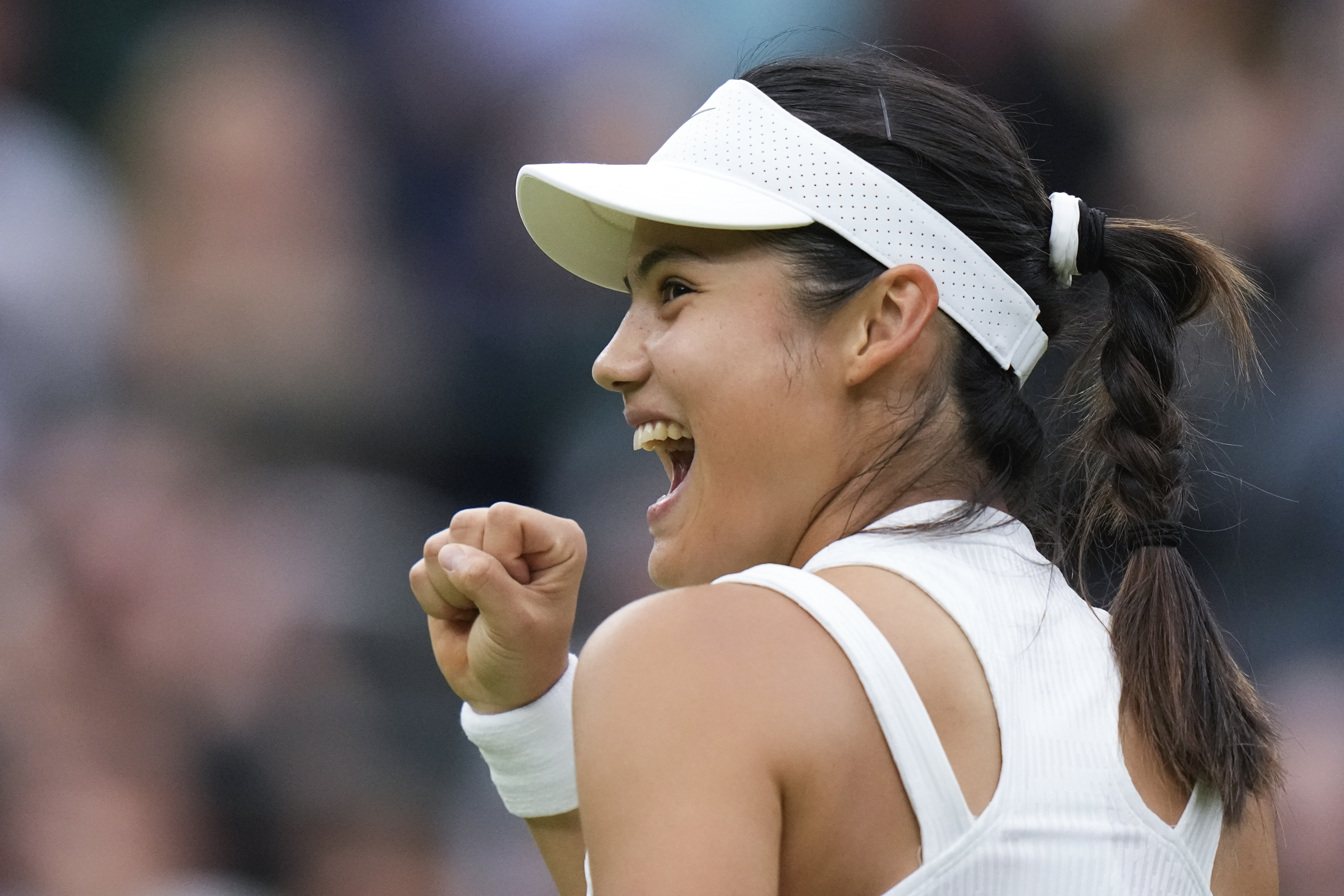 Emma Raducanu of Britain celebrates after defeating Elise Mertens of Belgium in their match on day three at the Wimbledon tennis championships in London, Wednesday, July 3, 2024.