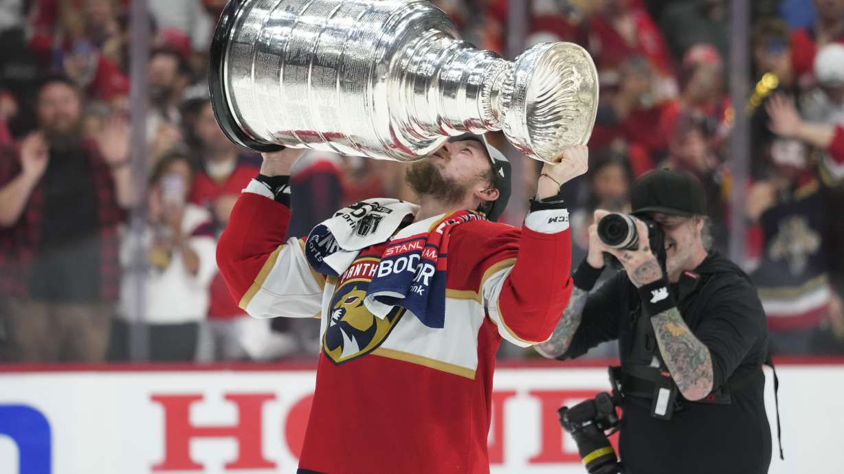 Florida Panthers right wing Vladimir Tarasenko kisses the Stanley Cup trophy after defeating the Edmonton Oilers in Game 7 of the NHL hockey Stanley Cup Final, Monday, June 24, 2024, in Sunrise, Fla.