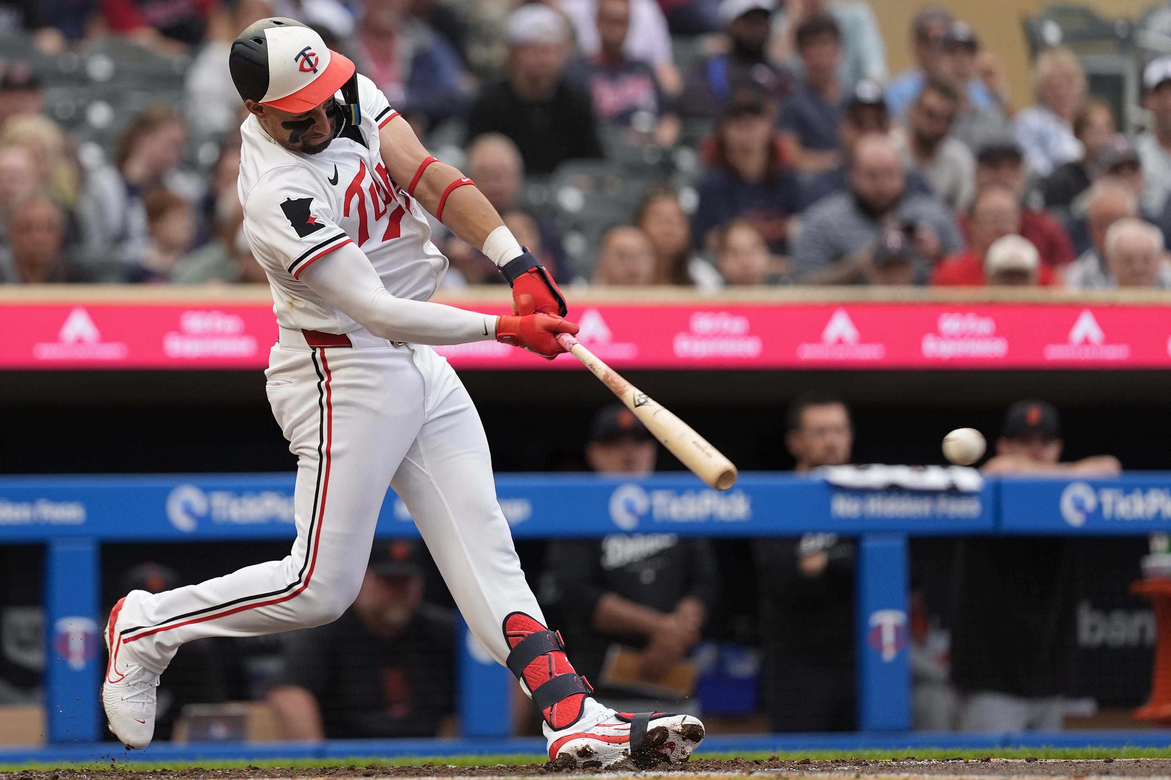 Minnesota Twins' Royce Lewis hits a two-run double during the third inning of a baseball game against the Detroit Tigers, Tuesday, July 2, 2024, in Minneapolis. 