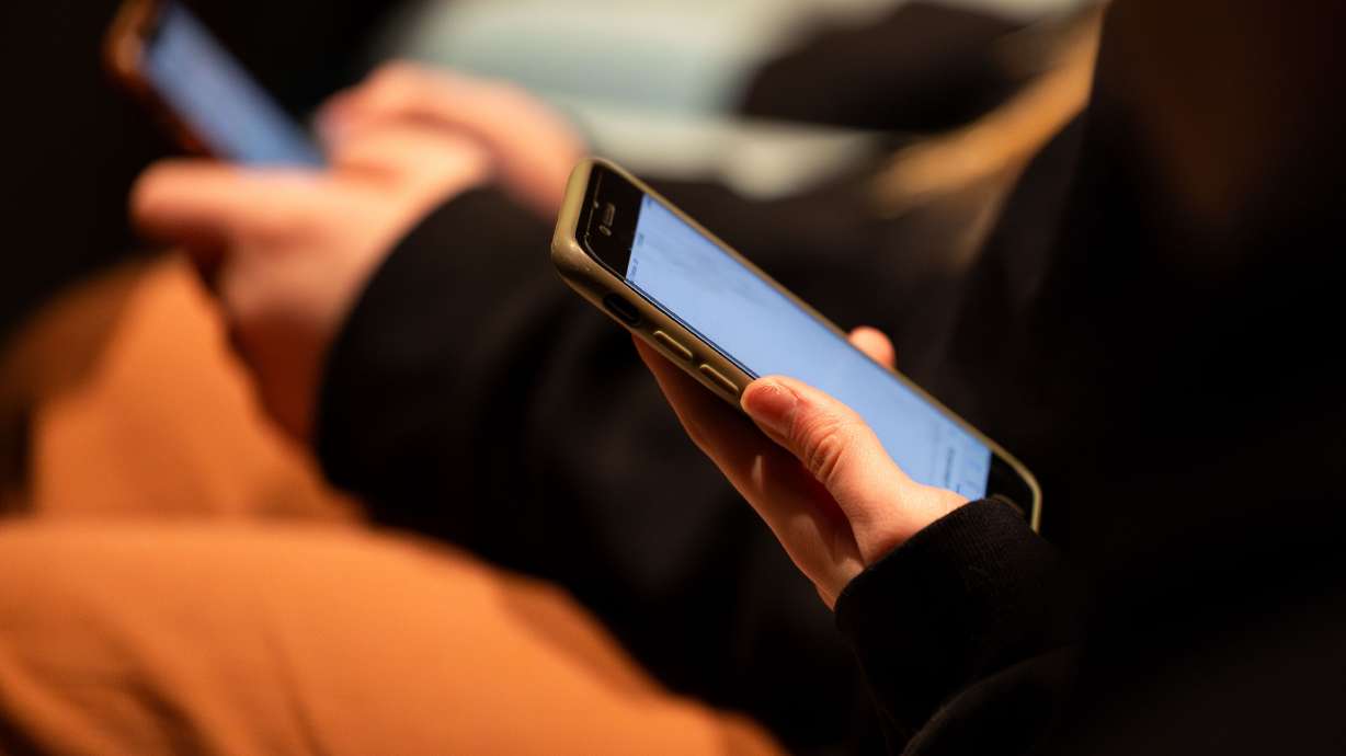 Students use their cellphones at Ben Lomond High School in Ogden on Feb. 7. The "I remember when I lost my mind" TikTok trend is funny — and sheds light on what it was like for young adults to grow up on social media.