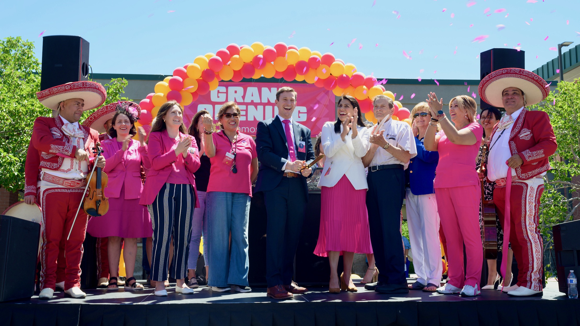 Leaders of Vamos Health, a West Valley City clinic geared to the Latino population, and others at a grand opening celebration held June 29. Vamos CEO John Woolley is in the middle, wearing the suit.