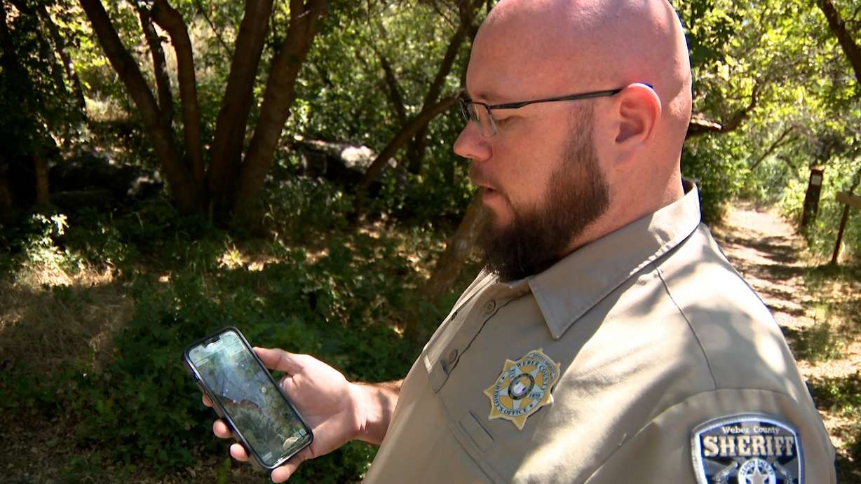 Sgt. Kyley Slater with the Weber County Sheriff's Office shows how CalTopo works with locating hikers through their phones.
