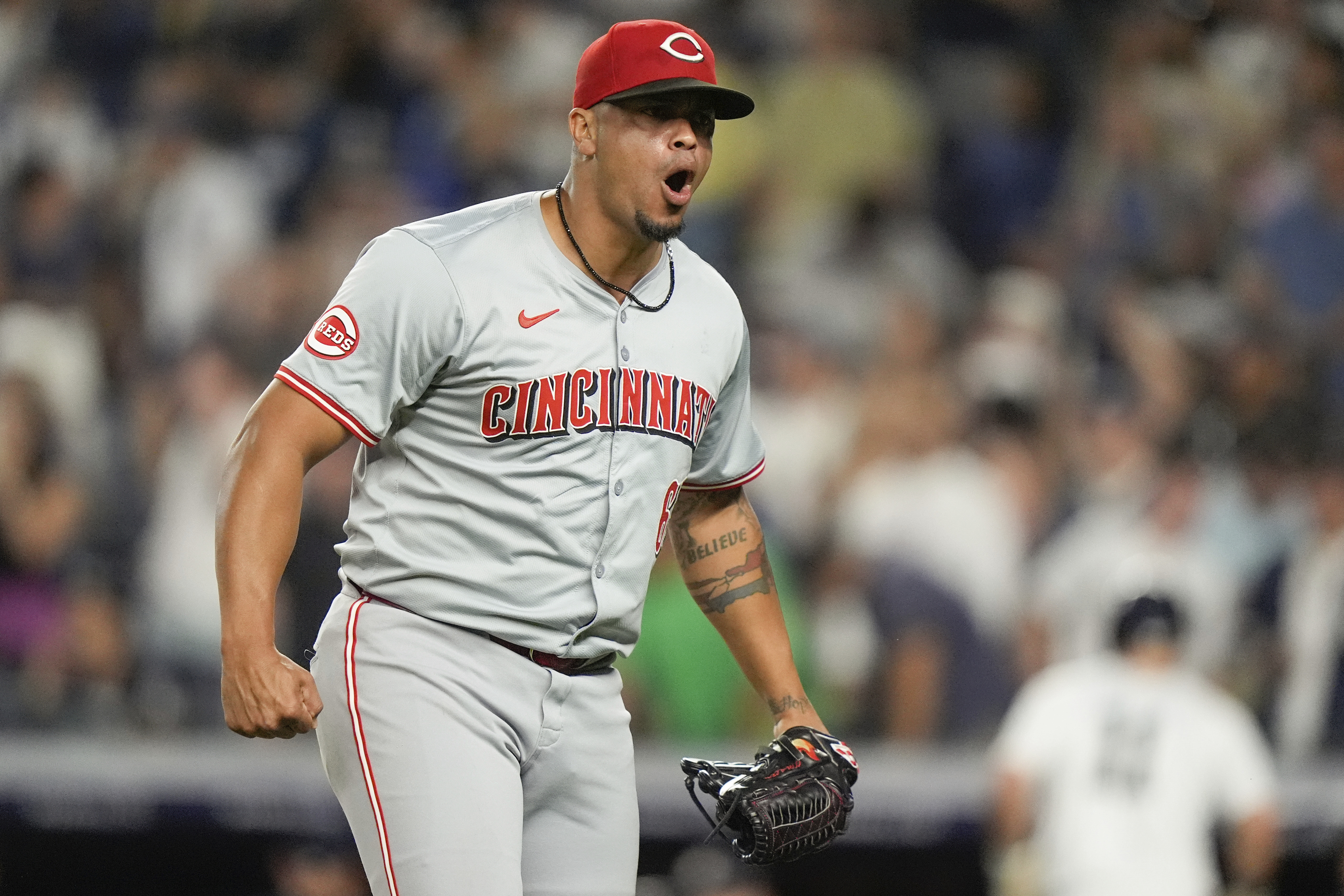 Cincinnati Reds pitcher Fernando Cruz reacts after New York Yankees' Aaron Judge hit into a double play during the seventh inning of a baseball game, Wednesday, July 3, 2024, in New York.