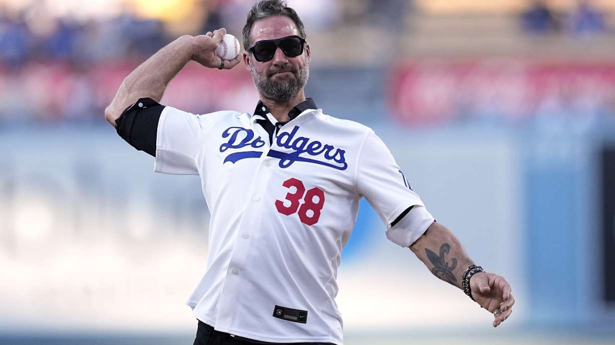 Former Los Angeles Dodgers reliever Eric Gagne throws out the ceremonial first pitch prior to a baseball game between the Dodgers and the Arizona Diamondbacks Wednesday, July 3, 2024, in Los Angeles.