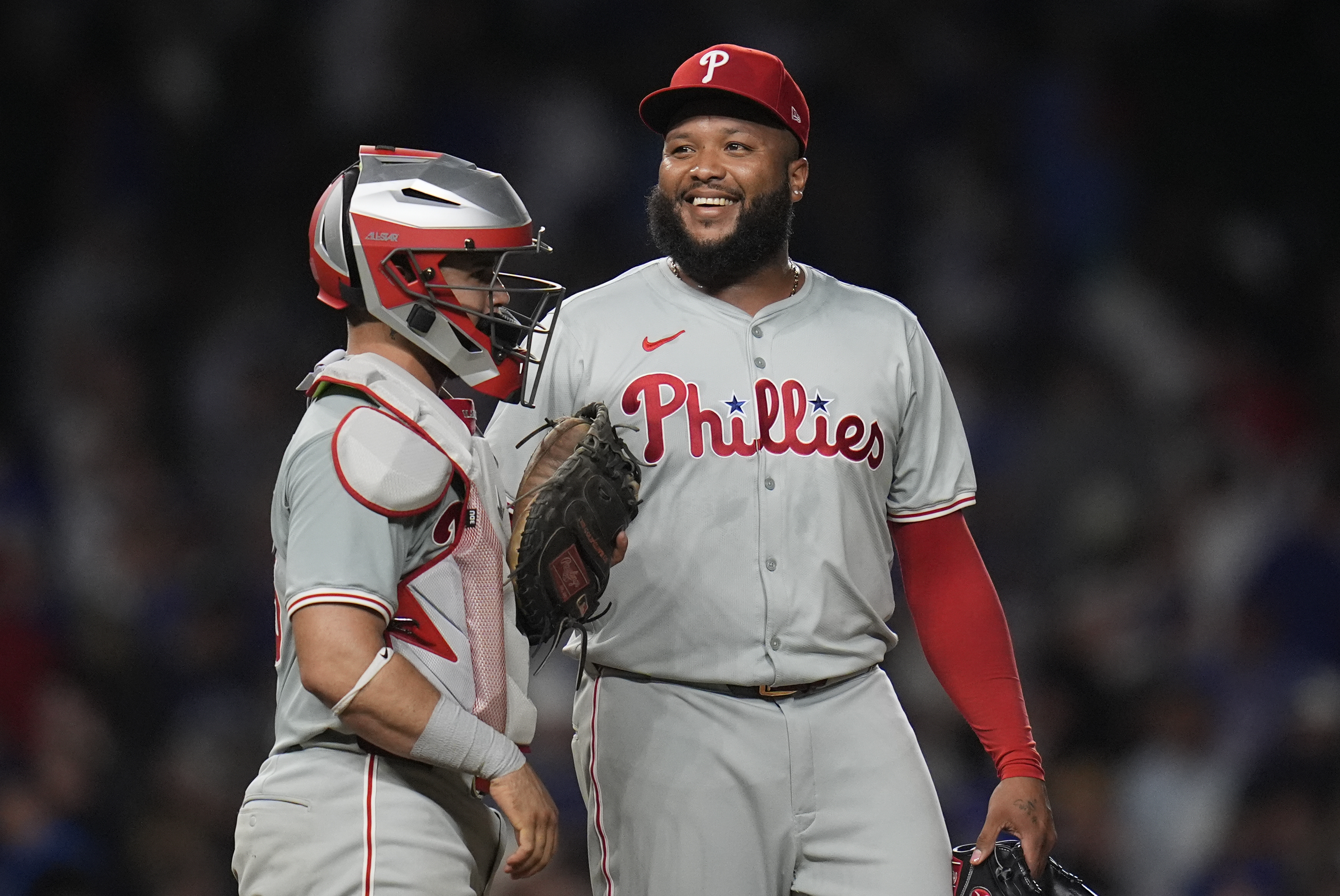 Philadelphia Phillies catcher Rafael Marchán, left, and pitcher José Alvarado celebrate their 5-3 win over the Chicago Cubs in a baseball game Wednesday, July 3, 2024, in Chicago. 