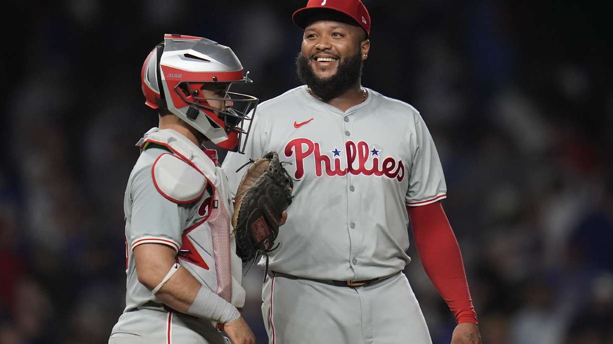 Philadelphia Phillies catcher Rafael Marchán, left, and pitcher José Alvarado celebrate their 5-3 win over the Chicago Cubs in a baseball game Wednesday, July 3, 2024, in Chicago.