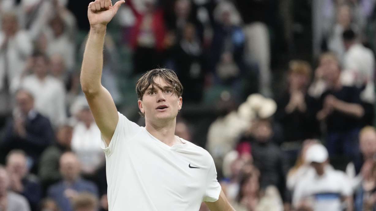Jack Draper of Britain celebrates after defeating Elias Ymer of Sweden in their first round match at the Wimbledon tennis championships in London, Tuesday, July 2, 2024.