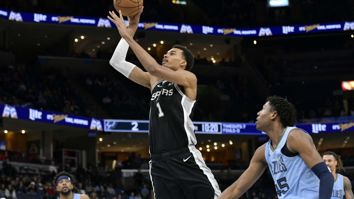 FILE - San Antonio Spurs center Victor Wembanyama (1) shoots ahead of Memphis Grizzlies forward GG Jackson (45) in the first half of an NBA basketball game April 9, 2024, in Memphis, Tenn. Wembanyama stole the show with spectacular one-handed dunks as France warmed up for its Paris Olympics gold medal bid with a 96-46 rout of Turkey.