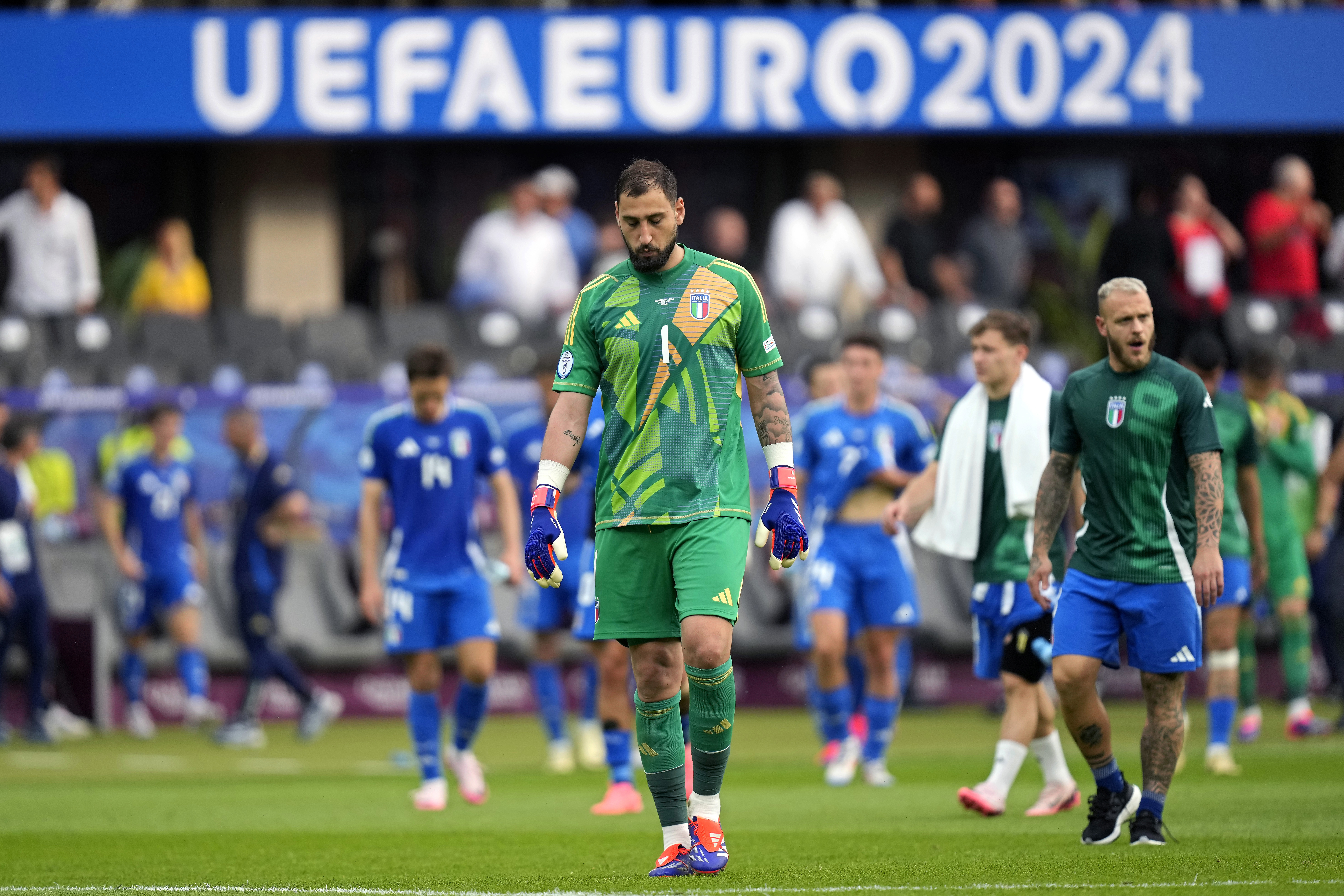 Italy's goalkeeper Gianluigi Donnarumma walks off at the end of a round of sixteen match between Switzerland and Italy at the Euro 2024 soccer tournament in Berlin, Germany, Saturday, June 29, 2024. Switzerland won the game 2-0.