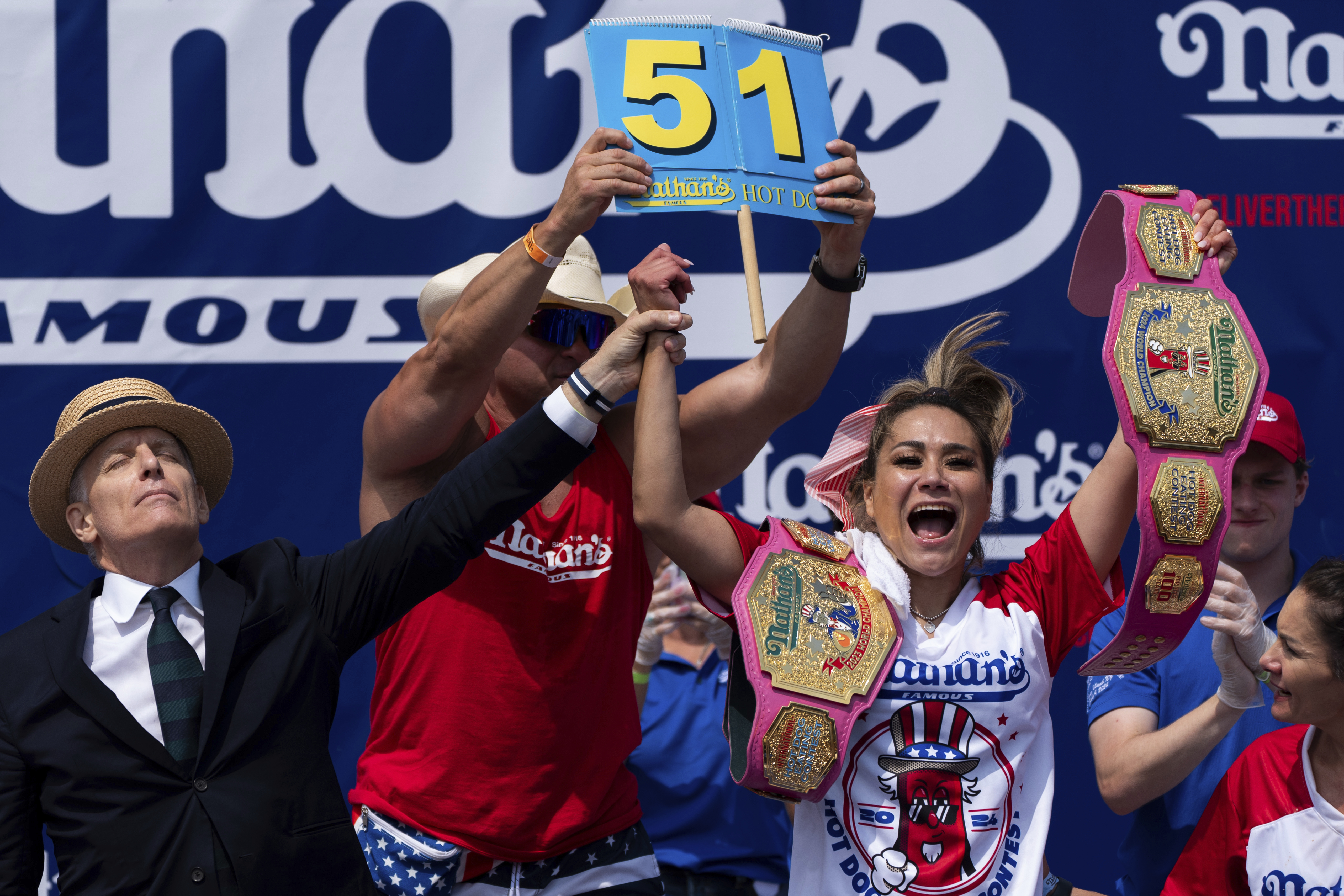 Miki Sudo reacts after winning the women's division in the Nathan's Famous Fourth of July hot dog eating contest, Thursday, at Coney Island in the Brooklyn borough of New York. Sudo ate a record 51 hot dogs.