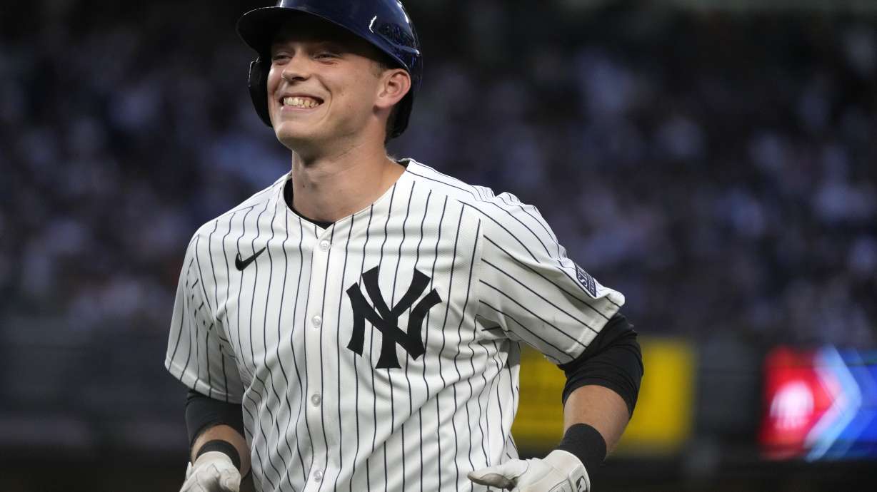 New York Yankees' Ben Rice reacts to fans cheering for him after flying out to Baltimore Orioles center fielder Cedric Mullins during the fourth inning of a baseball game, Wednesday, June 19, 2024, in New York.