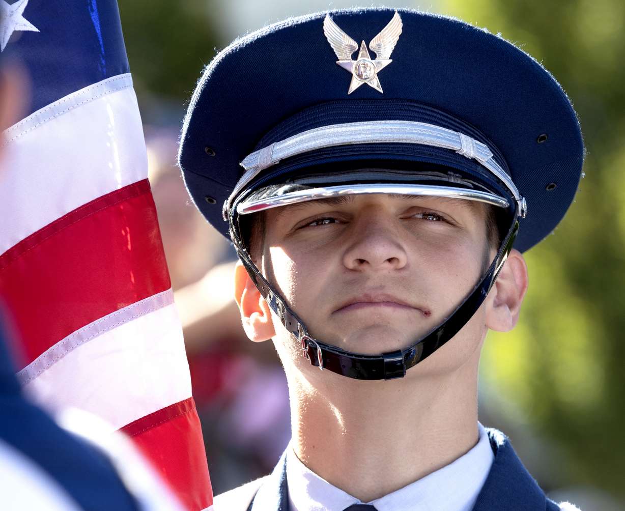 A member of the Brigham Young University ROTC prepares to present the American flag before the Freedom Festival Grand Parade in Provo on Thursday.