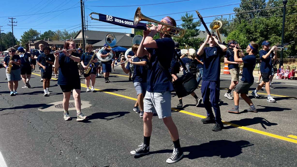 Members of the Layton High School marching band perform in the Liberty Days Parade in Layton on Thursday.