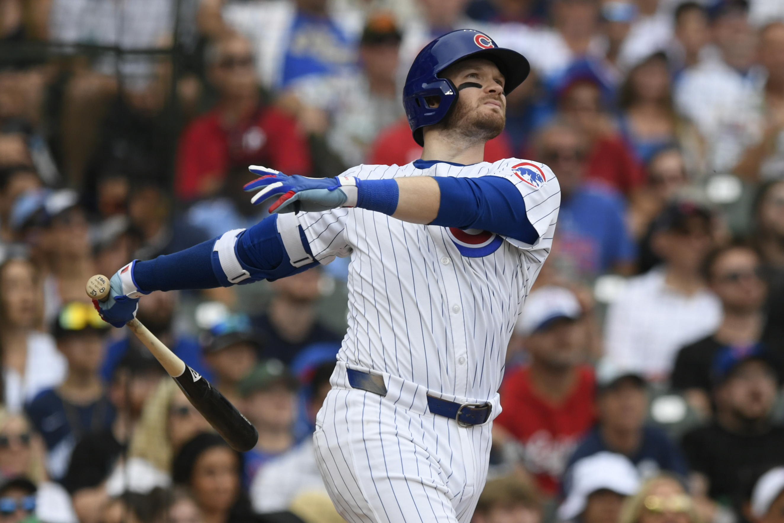 Chicago Cubs' Ian Happ watches his three-run home run during the fifth inning of a baseball game against the Philadelphia Phillies, Thursday, July 4, 2024, in Chicago.