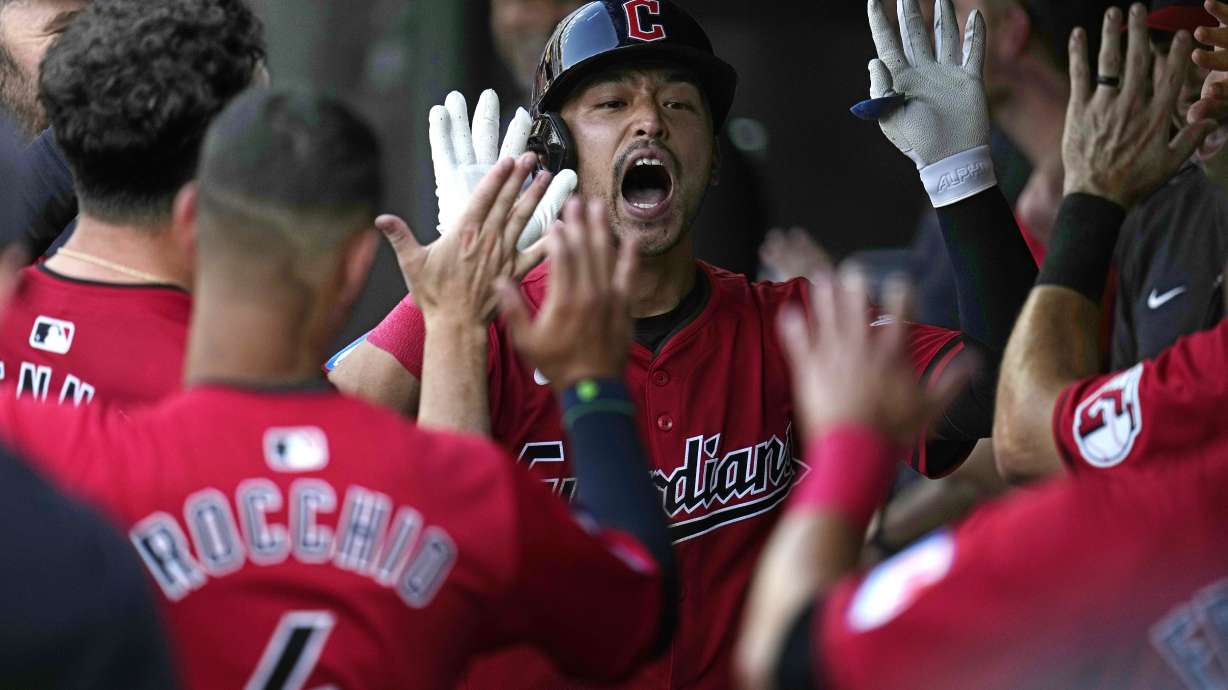 Cleveland Guardians' Steven Kwan celebrates in the dugout after hitting a home run against the Seattle Mariners during the second inning of a baseball game Wednesday, June 19, 2024, in Cleveland.