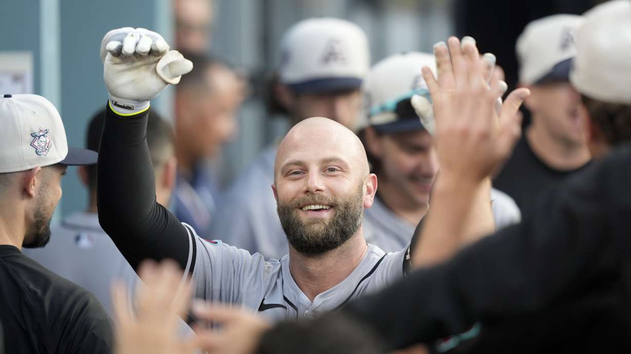 Arizona Diamondbacks' Christian Walker celebrates after his two-run home run during the third inning of a baseball game against the Los Angeles Dodgers, Thursday, July 4, 2024, in Los Angeles.