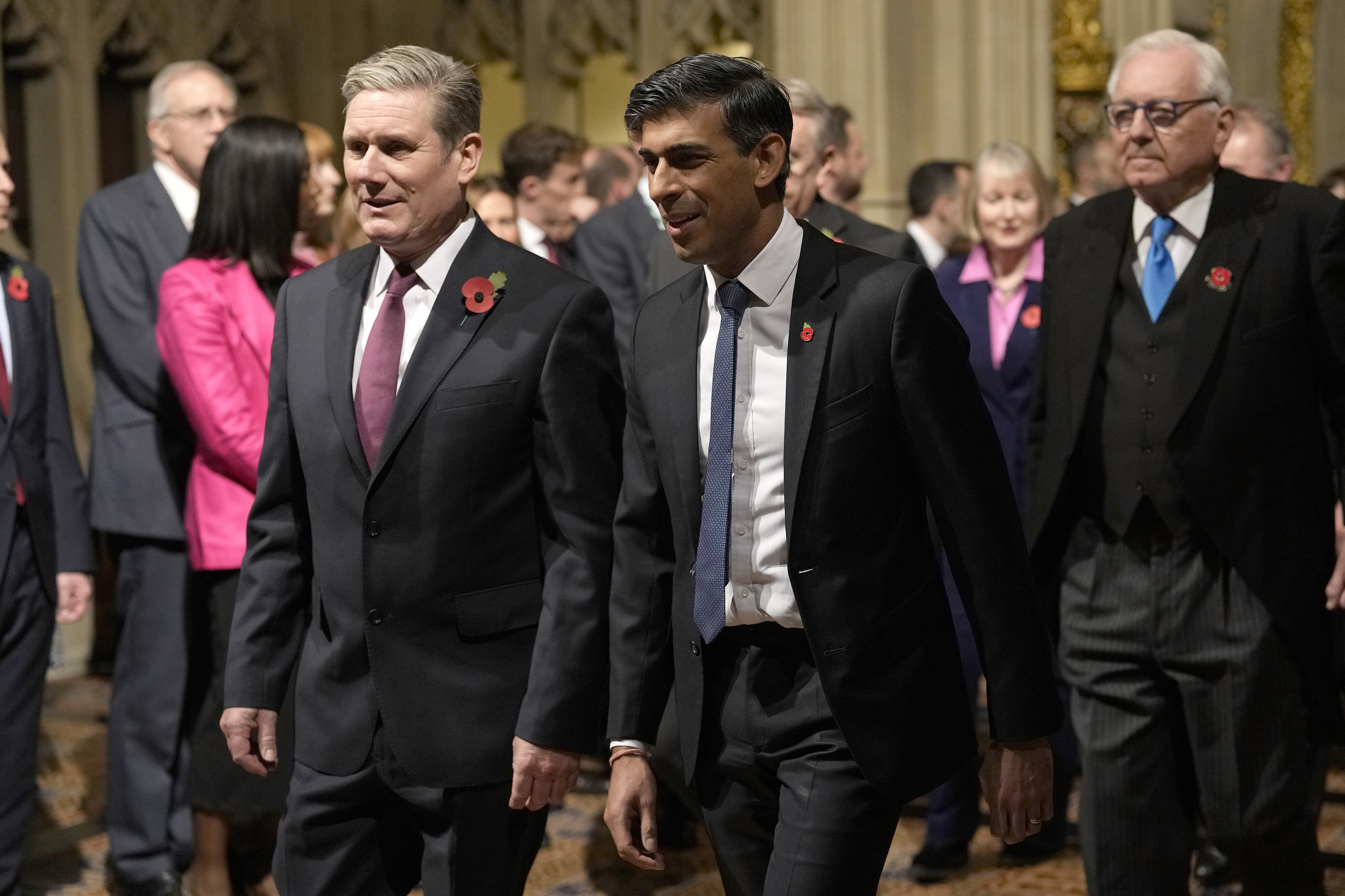 Britain's Prime Minister Rishi Sunk, right, and Labour Party leader Keir Starmer pass through the Peer's Lobby to attend the State Opening of Parliament, at the Palace of Westminster in London, Nov. 7, 2023. Starmer delivered a sensational election result Thursday.