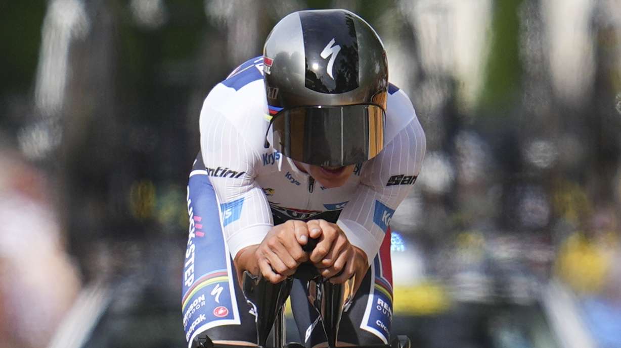 Stage winner Belgium's Remco Evenepoel strains during the seventh stage of the Tour de France cycling race, an individual time-trial over 25.3 kilometers (15.7 miles) with start Nuits-Saint-Georges and finish in Gevrey-Chambertin, France, Friday, July 5, 2024.