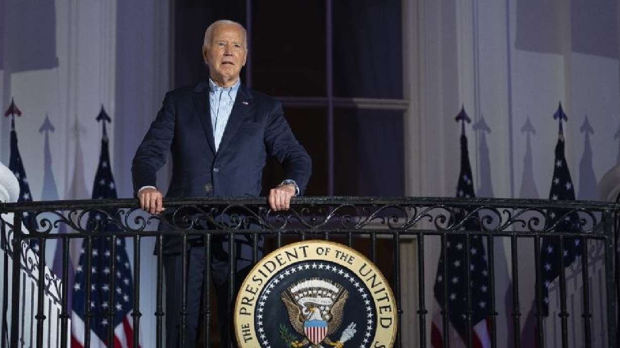 President Joe Biden stands on the balcony of the White House, Thursday in Washington. Biden is fighting to save his endangered reelection effort as he holds a rally in Wisconsin on Friday.