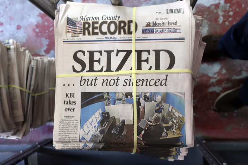 A stack of the Marion County Record sits in the back of the newspaper's building, awaiting unbundling, sorting and distribution, Aug. 16, 2023, in Marion, Kan.
