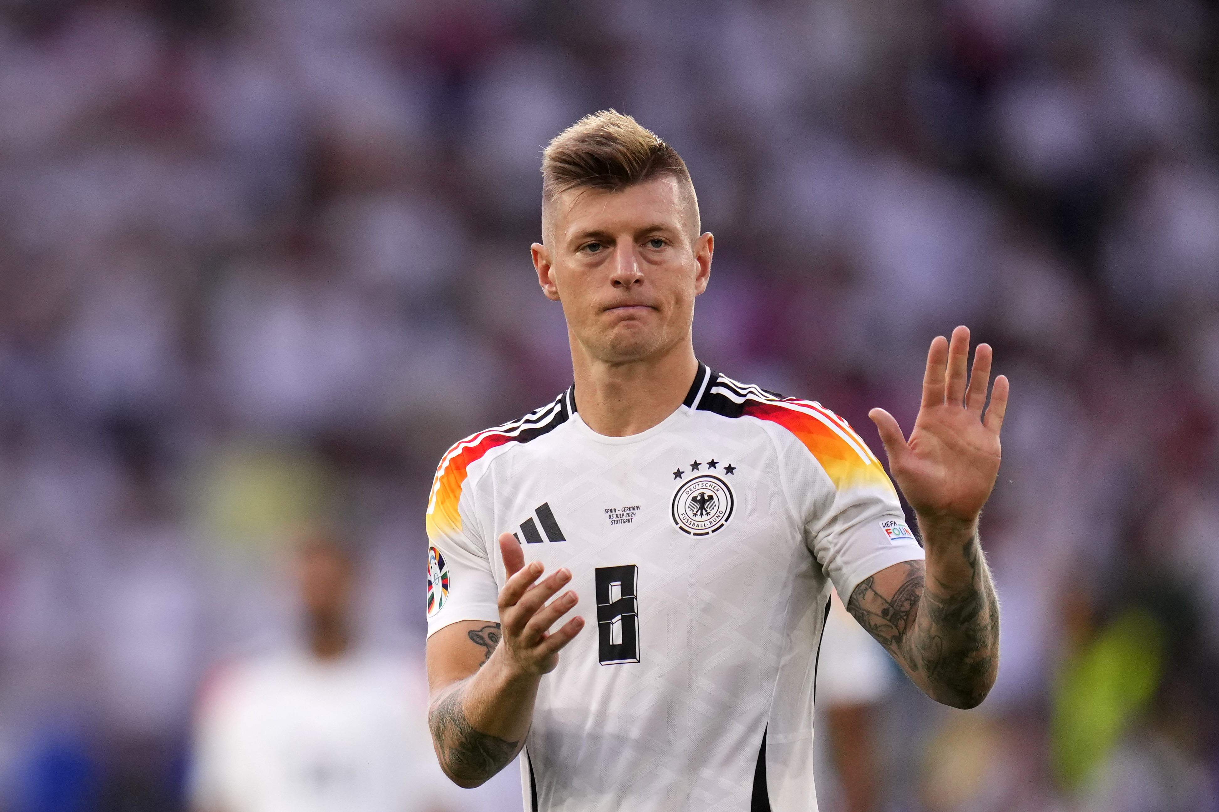Germany's Toni Kroos walks off the pitch after a quarter final match between Germany and Spain at the Euro 2024 soccer tournament in Stuttgart, Germany, Friday, July 5, 2024.