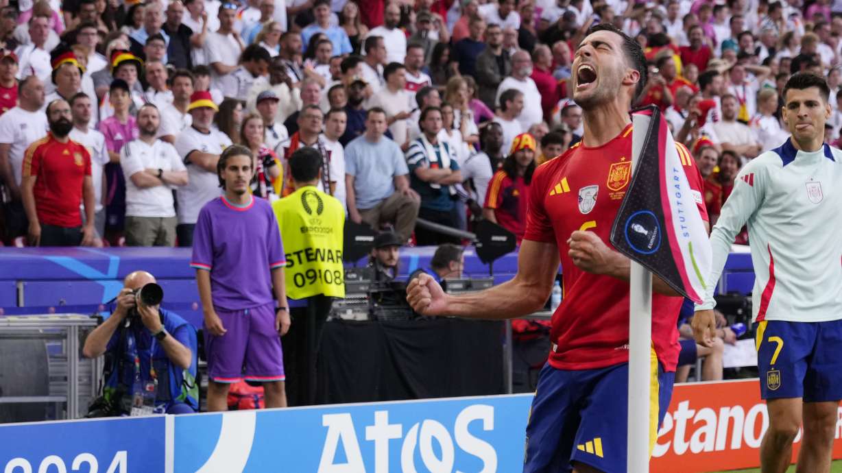 Spain's Mikel Merino celebrates after scoring his sides second goal during a quarter final match between Germany and Spain at the Euro 2024 soccer tournament in Stuttgart, Germany, Friday, July 5, 2024.