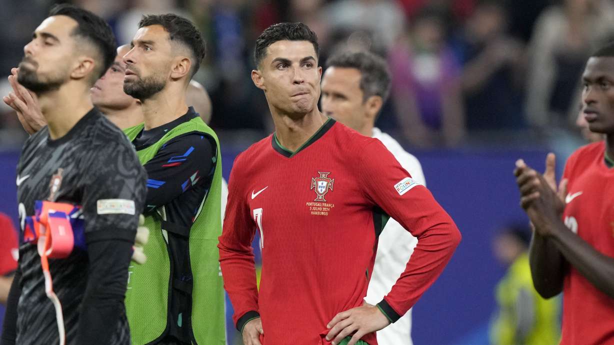 Portugal's Cristiano Ronaldo reacts after losing a quarter final match between Portugal and France at the Euro 2024 soccer tournament in Hamburg, Germany, Friday, July 5, 2024. France won a penalty shoot out 4-3 after the match ended in a 0-0 draw.