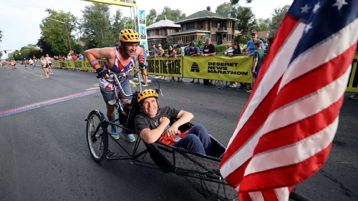 Danny Connolly and Brian Connolly finish the Deseret News Marathon at Liberty Park in Salt Lake City on July 24, 2023.