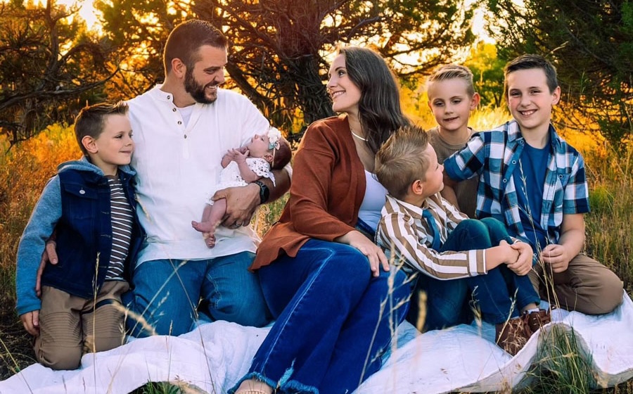 Bryan Grover and his wife Hayley Grover are photographed along with their five kids. Bryan Grover died in a crash in Idaho on June 25.