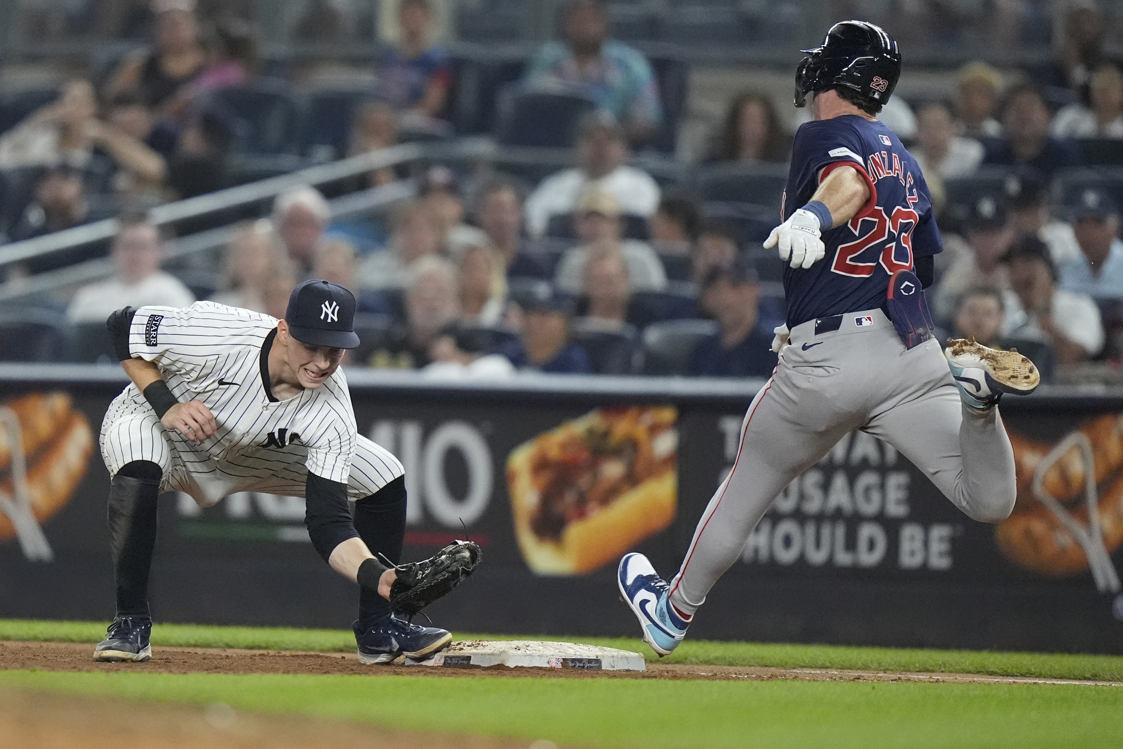 Boston Red Sox's Romy Gonzalez (23) is thrown out at first base by New York Yankees pitcher Luke Weaver as Yankees' Ben Rice, left, catches the ball during the seventh inning of a baseball game, Friday, July 5, 2024, in New York. 