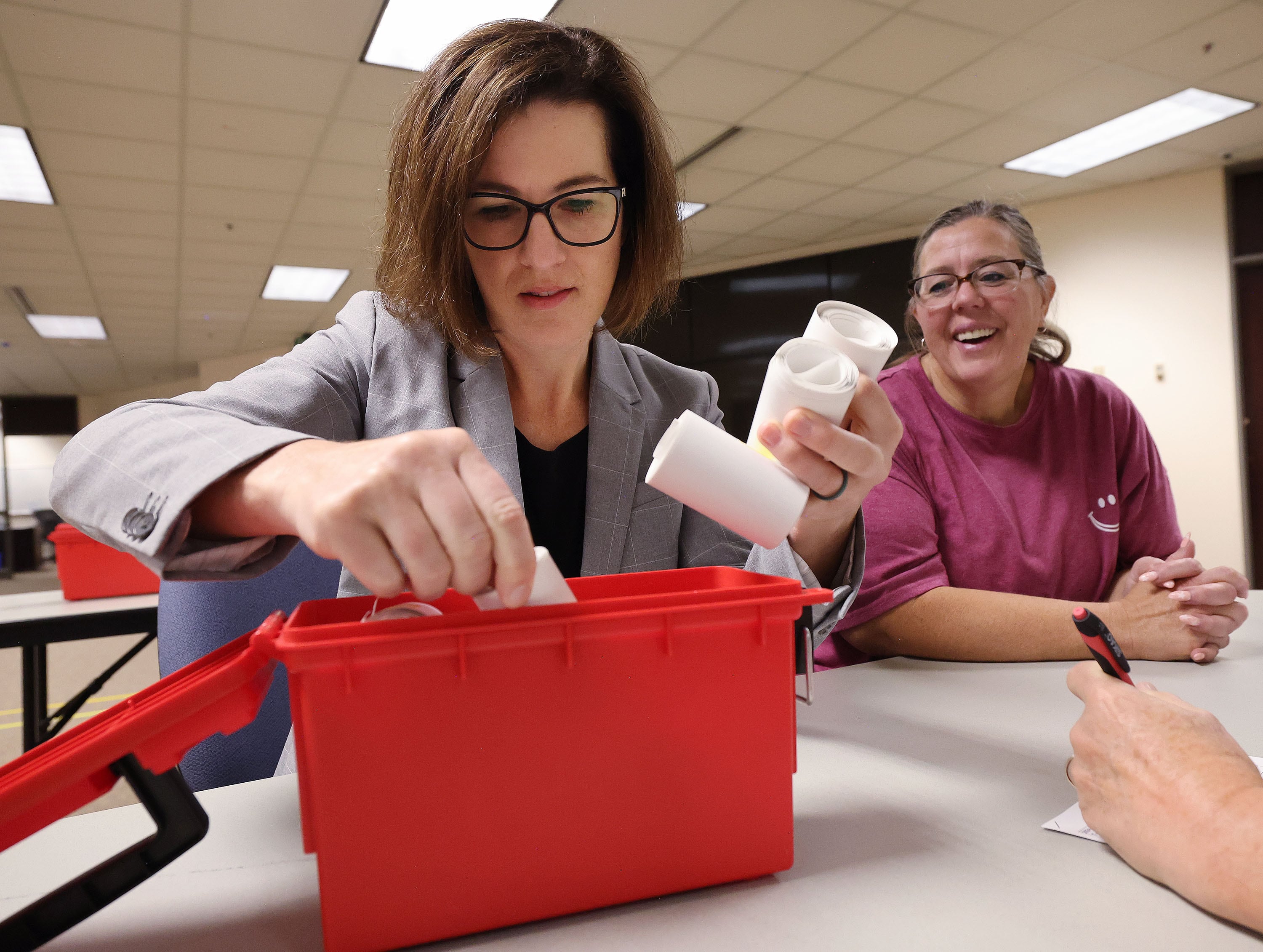 Suzanne Harrison, a member of the Salt Lake County Council, and Teresa Medici audit the primary election at the Salt Lake County Government Center in Salt Lake City on Tuesday.