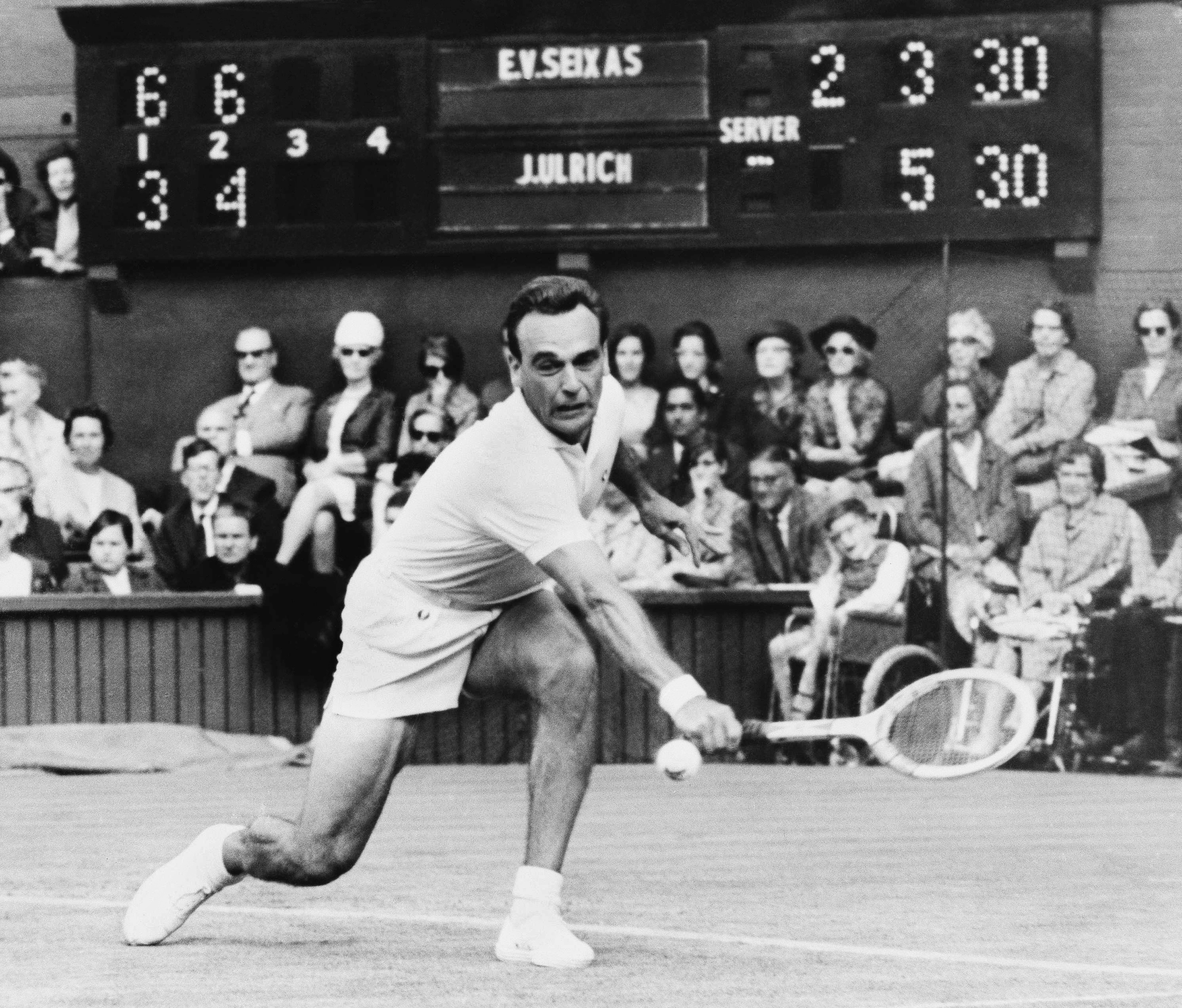 FILE - Vic Seixas of the United States backhands a volley from Denmark's Jurgen Ulrich in the first round of men's singles match at Wimbledon, England, June 27, 1967. Vic Seixas, a Wimbledon winner and tennis Hall of Famer who was the oldest living Grand Slam champion, has died at the age of 100. The International Tennis Hall of Fame announced Seixas’ death on Saturday July 6, 2024, based on confirmation from his daughter Tori.