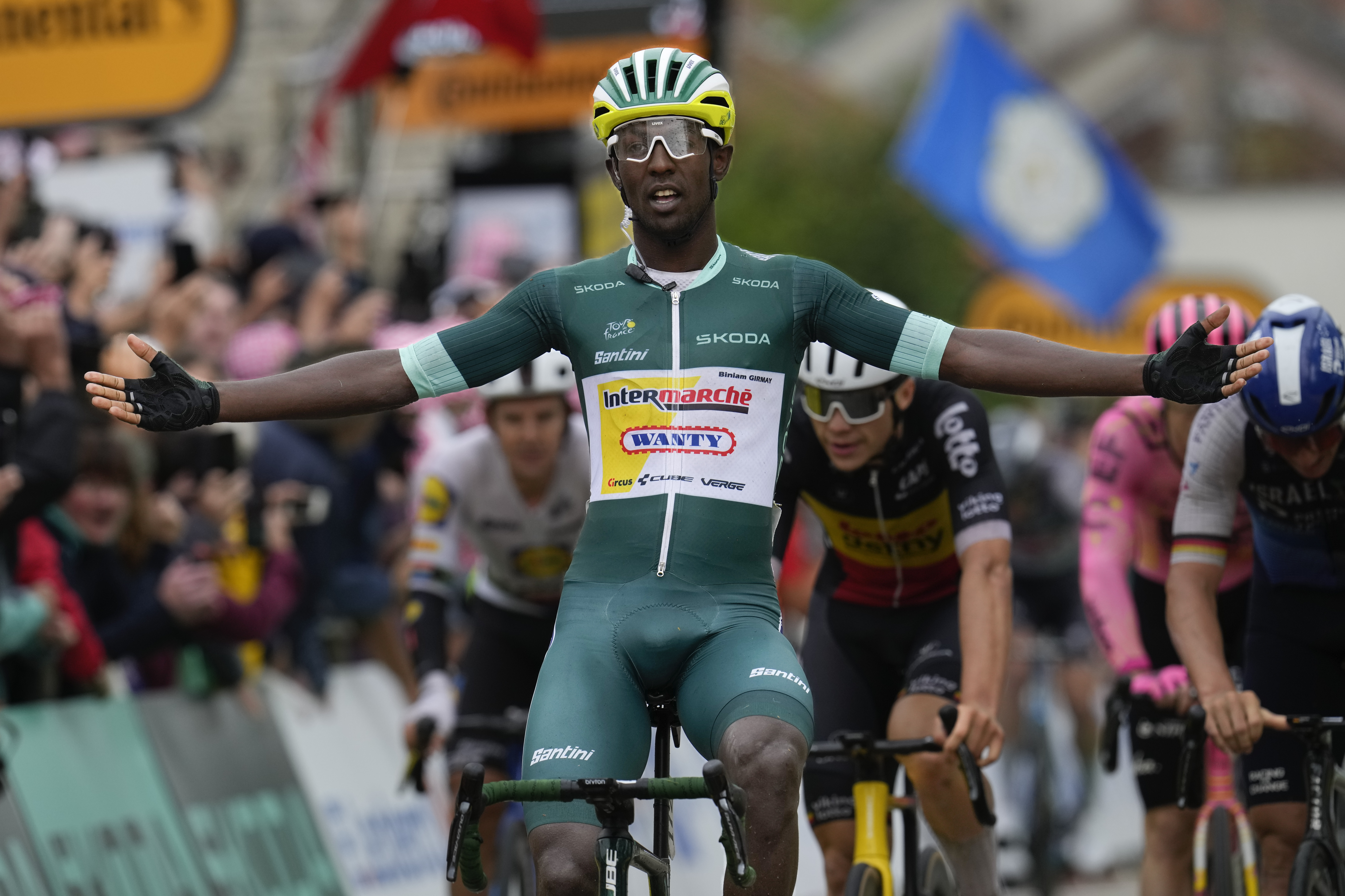 Eritrea's Biniam Girmay crosses the finish line to win the eighth stage of the Tour de France cycling race over 183.4 kilometers (114 miles) with start in Semur-en-Auxois and finish in Colombey-les-Deux-Eglises, France, Saturday, July 6, 2024. 