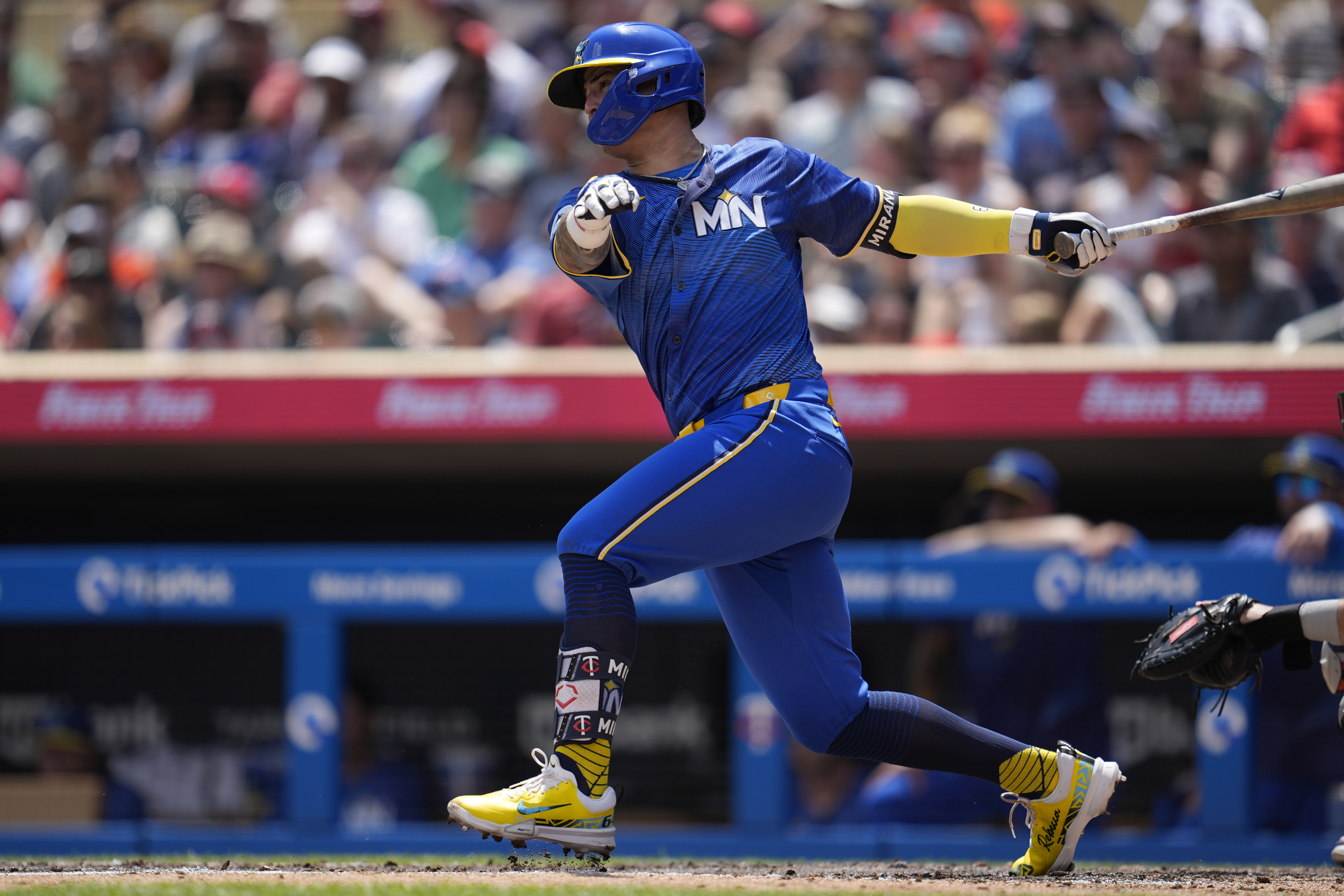 Minnesota Twins' Jose Miranda hits an RBI-single during the second inning of a baseball game against the Houston Astros, Saturday, July 6, 2024, in Minneapolis. 